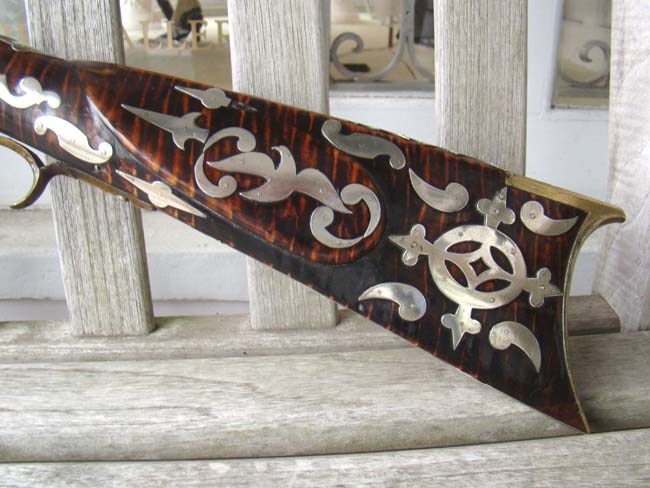 An impressive tiger-maple half-stock silver mounted percussion Frontier Rifle by William McCleland of Naffanees, Indiana, circa 1860-1862.